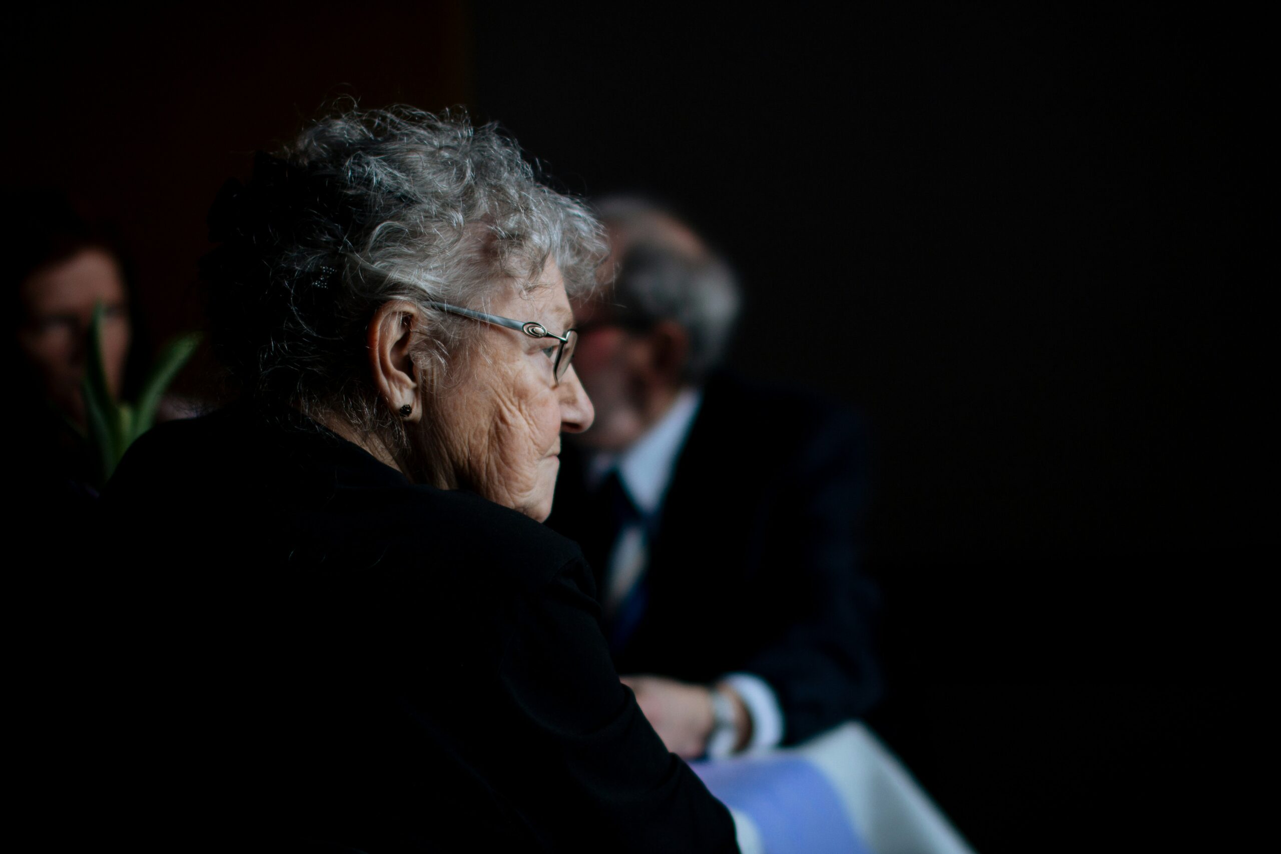 An old woman wearing black clothes